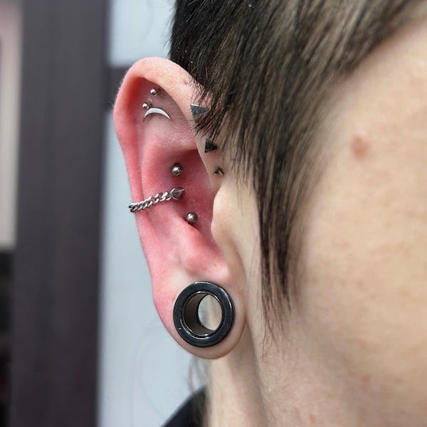 triple conch piercing by paola, fattys tattoos and piercings