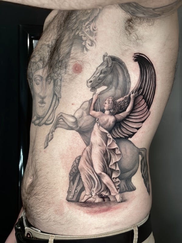 Goddess and stalion tattoo by Alex, artist at Fattys Tattoos & Piercings