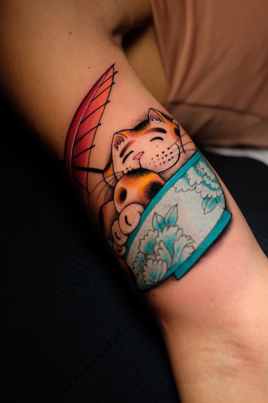 Happy cat tattoo by Alex, artist at Fattys Tattoos & Piercings