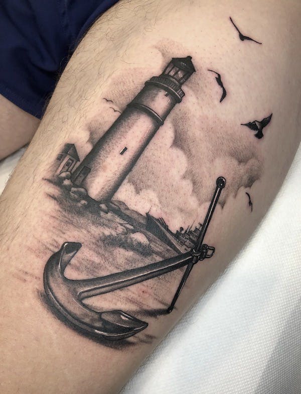 Lighthouse and anchor tattoo by Alex, artist at Fattys Tattoos & Piercings