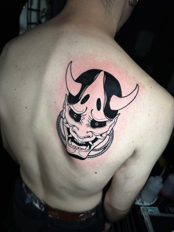 Oni mask tattoo by Alex, artist at Fattys Tattoos & Piercings