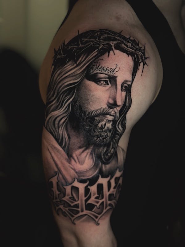 Realistic Jesus portrait tattoo by Alex, artist at Fattys Tattoos & Piercings