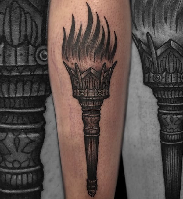 Torch tattoo by Alex, artist at Fattys Tattoos & Piercings