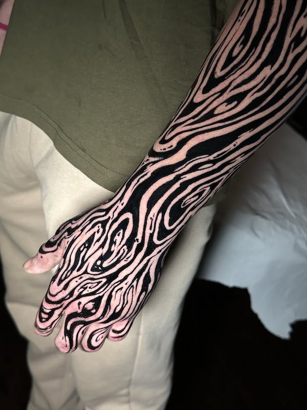 Trippy tribal sleeve tattoo by Alex #2, artist at Fattys Tattoos & Piercings