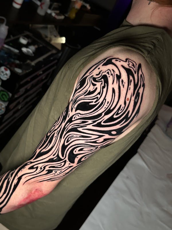 Trippy tribal sleeve tattoo by Alex, artist at Fattys Tattoos & Piercings